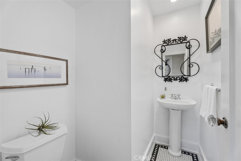 287 Myrtle Street Laguna Beach, CA 92651 - Photo 8 of 50 a bathroom with a sink and mirror