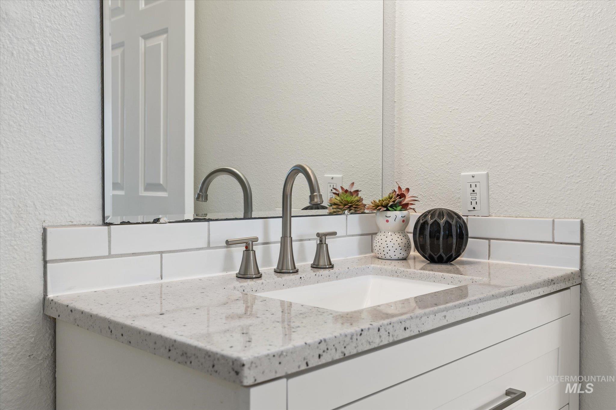 1399 West Gander Drive Meridian, ID 83642 - Photo 29 of 40 Bathroom view of a textured wall and vanity