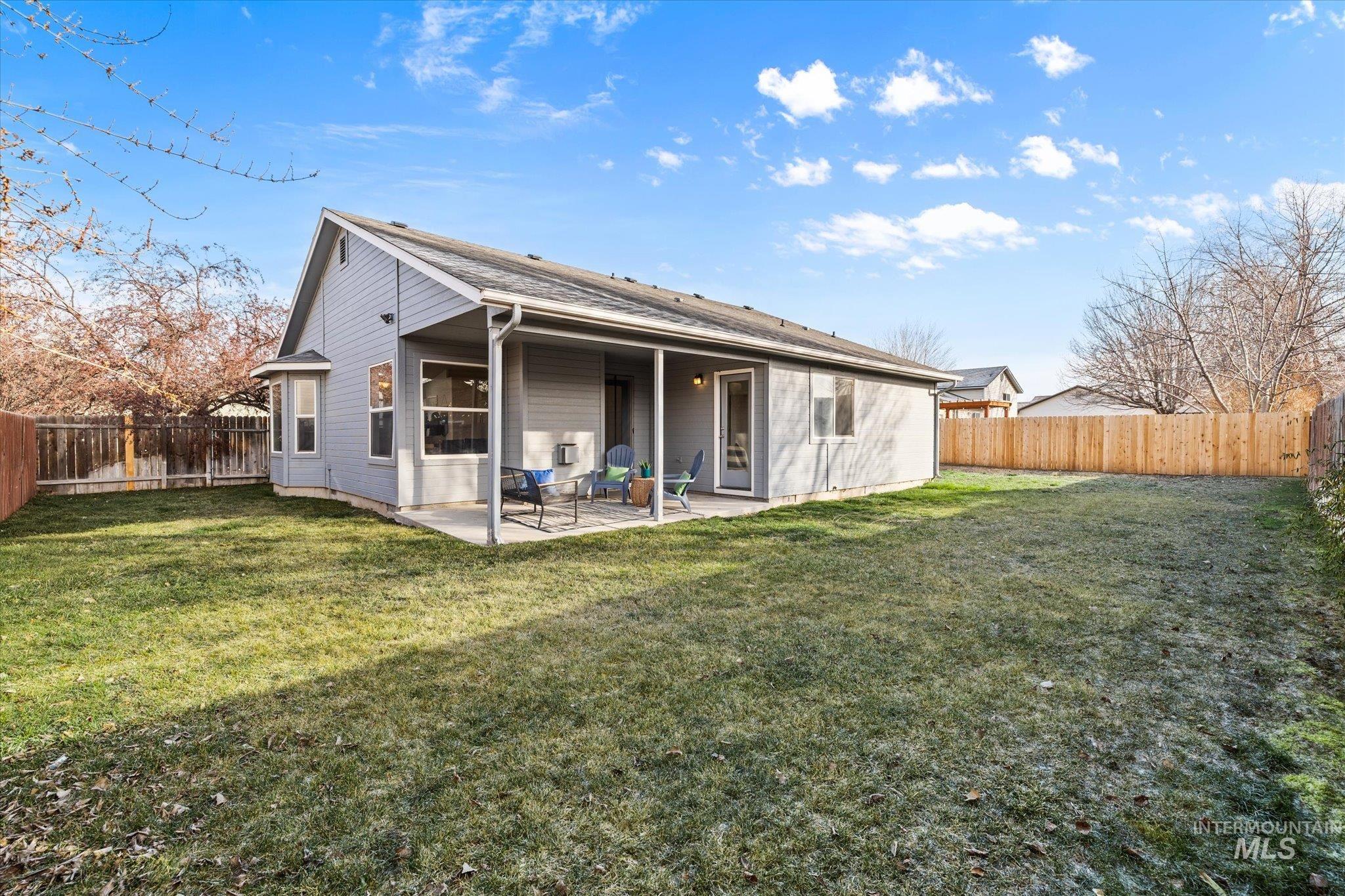 1399 West Gander Drive Meridian, ID 83642 - Photo 3 of 40 Rear view of property with a patio area and a fenced backyard
