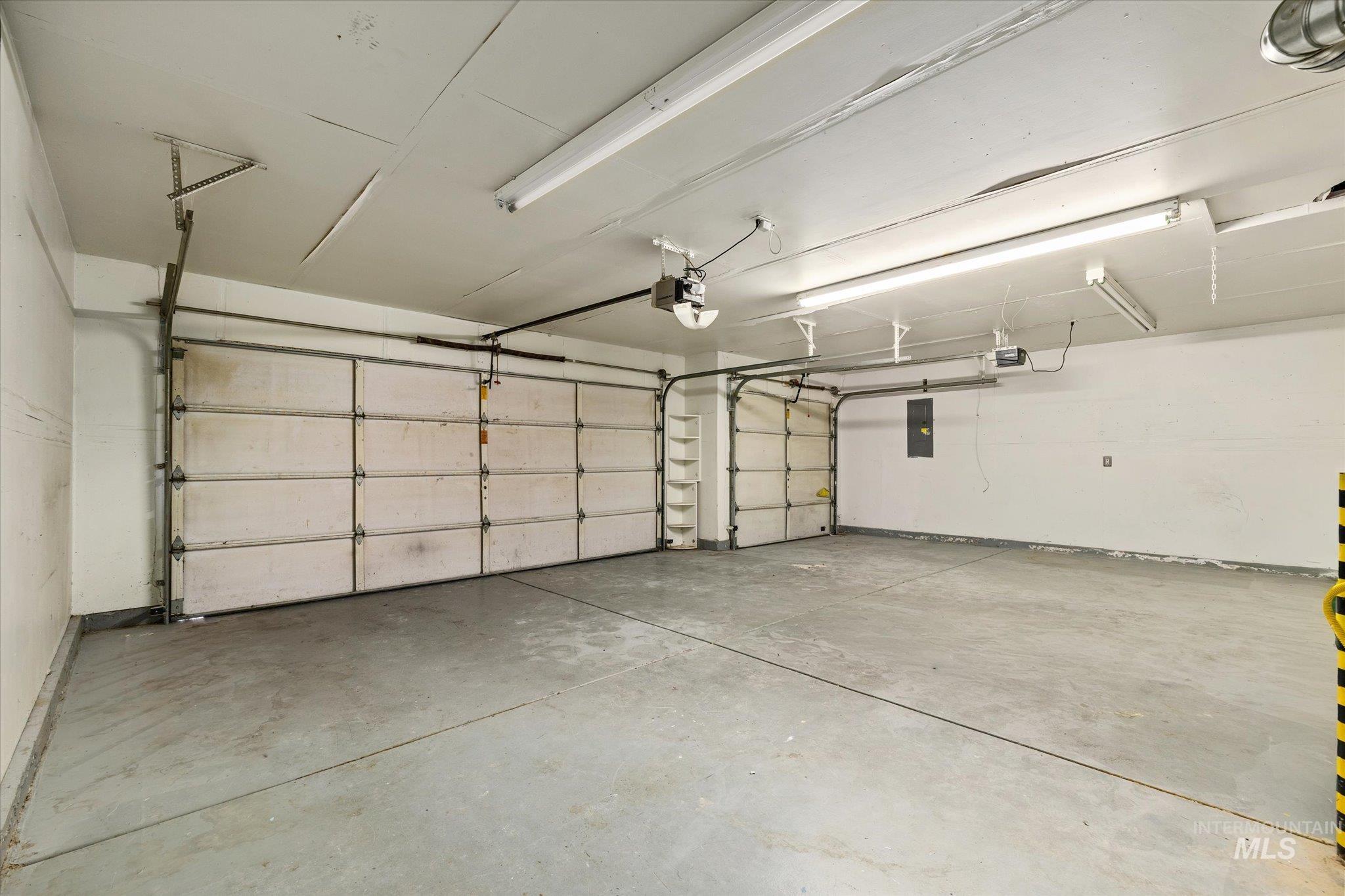 1399 West Gander Drive Meridian, ID 83642 - Photo 37 of 40 Garage featuring electric panel and a garage door opener