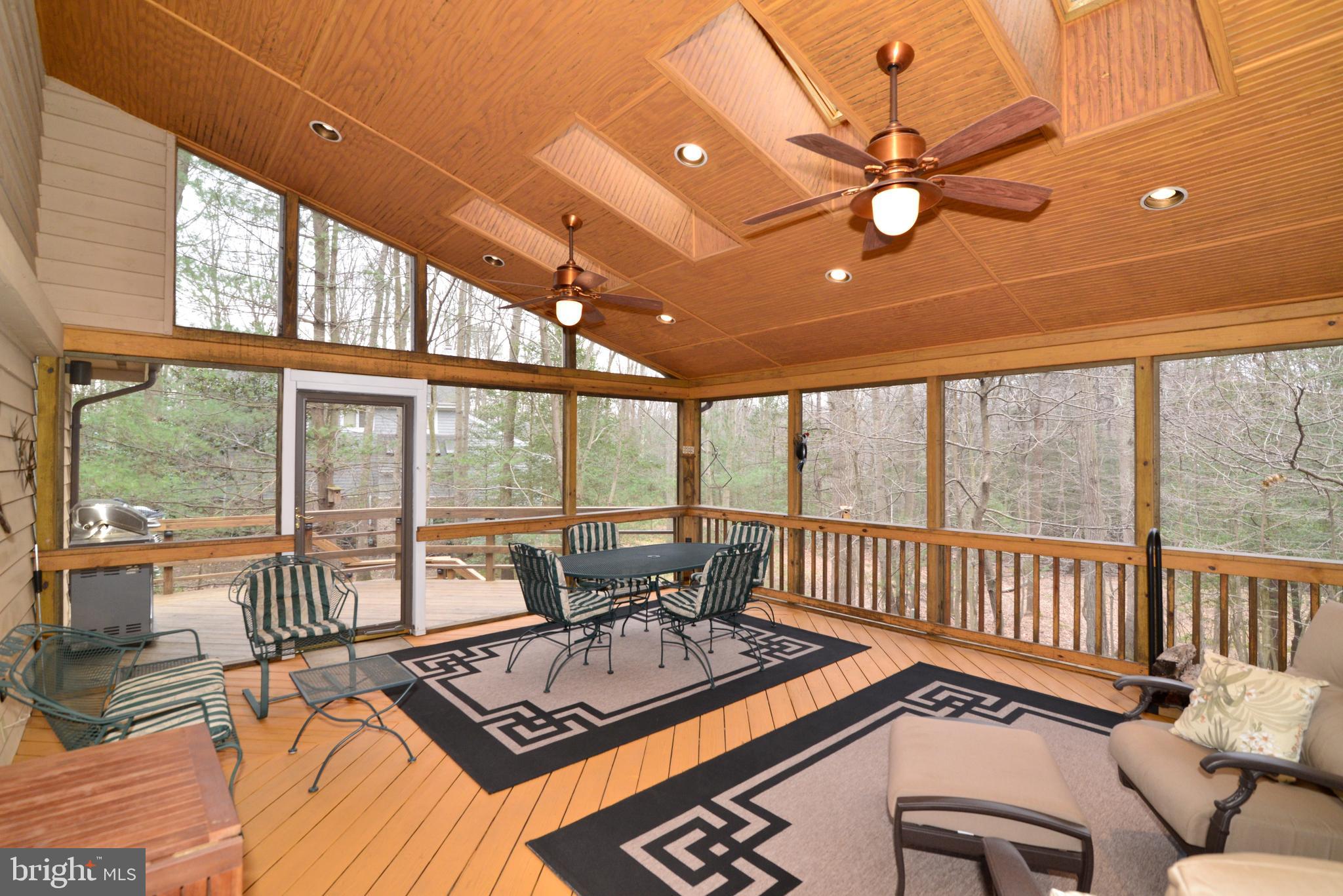 11410 Fieldstone Lane Reston, VA 20191 - Photo 18 of 50 a view of a workspace with furniture and floor to ceiling window