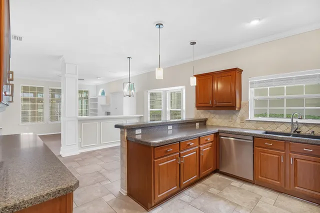 a kitchen with a sink stove and microwave