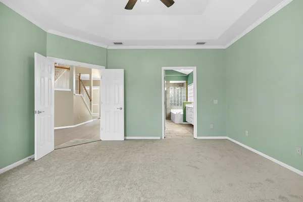 a view of an empty room with a fireplace and a window