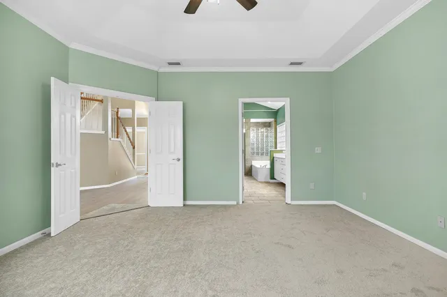 a view of an empty room with a fireplace and a window