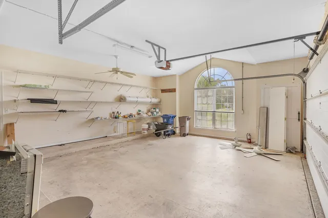 an aerial view of residential houses with outdoor space and swimming pool