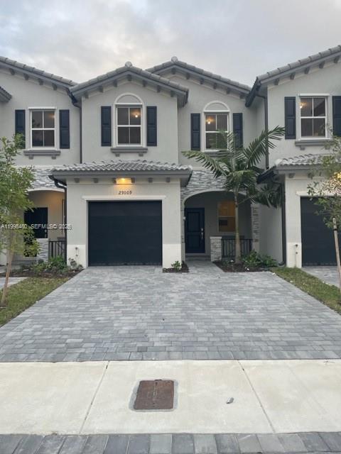 a front view of a house with yard