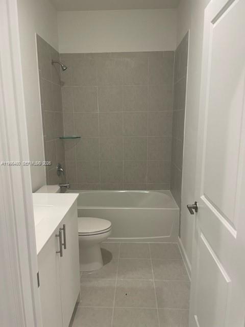 29009 Southwest 162nd Court, Unit 29009 Homestead, FL 33033 - Photo 11 of 26 a bathroom with a sink a toilet and shower