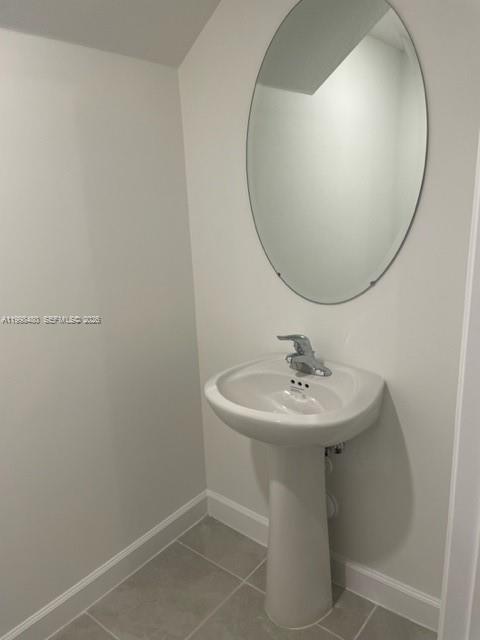 29009 Southwest 162nd Court, Unit 29009 Homestead, FL 33033 - Photo 8 of 26 a bathroom with a sink and a mirror