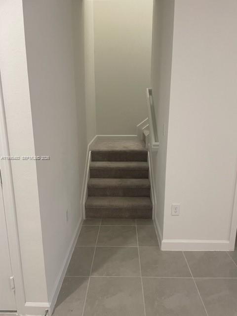 29009 Southwest 162nd Court, Unit 29009 Homestead, FL 33033 - Photo 10 of 26 a view of staircase with white walls
