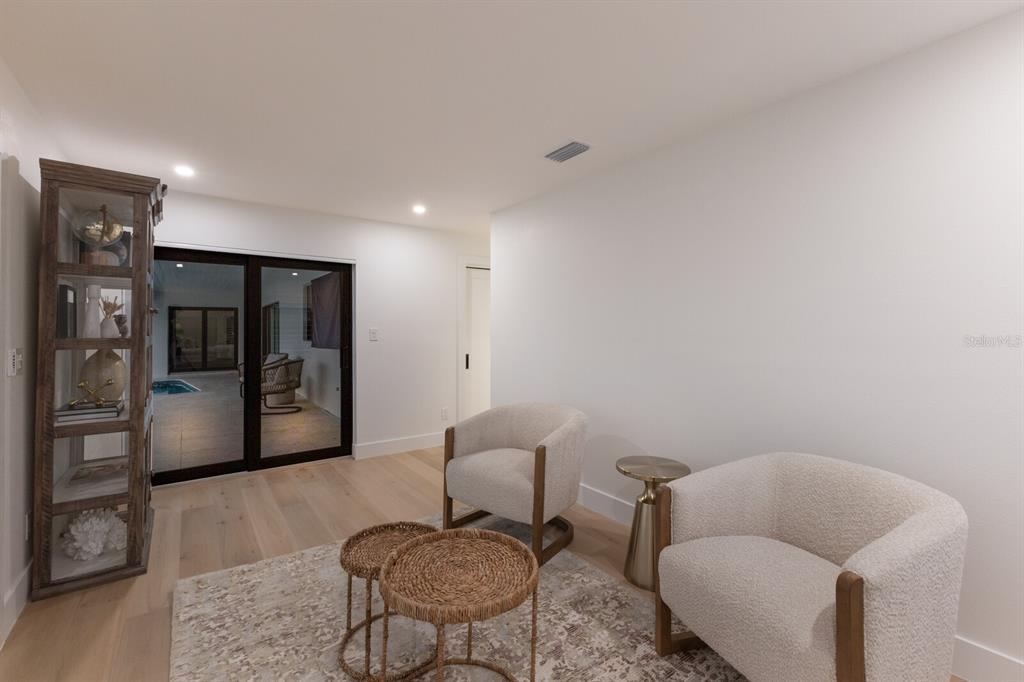 510 Putter Lane Longboat Key, FL 34228 - Photo 14 of 74 a living room with furniture and a rug