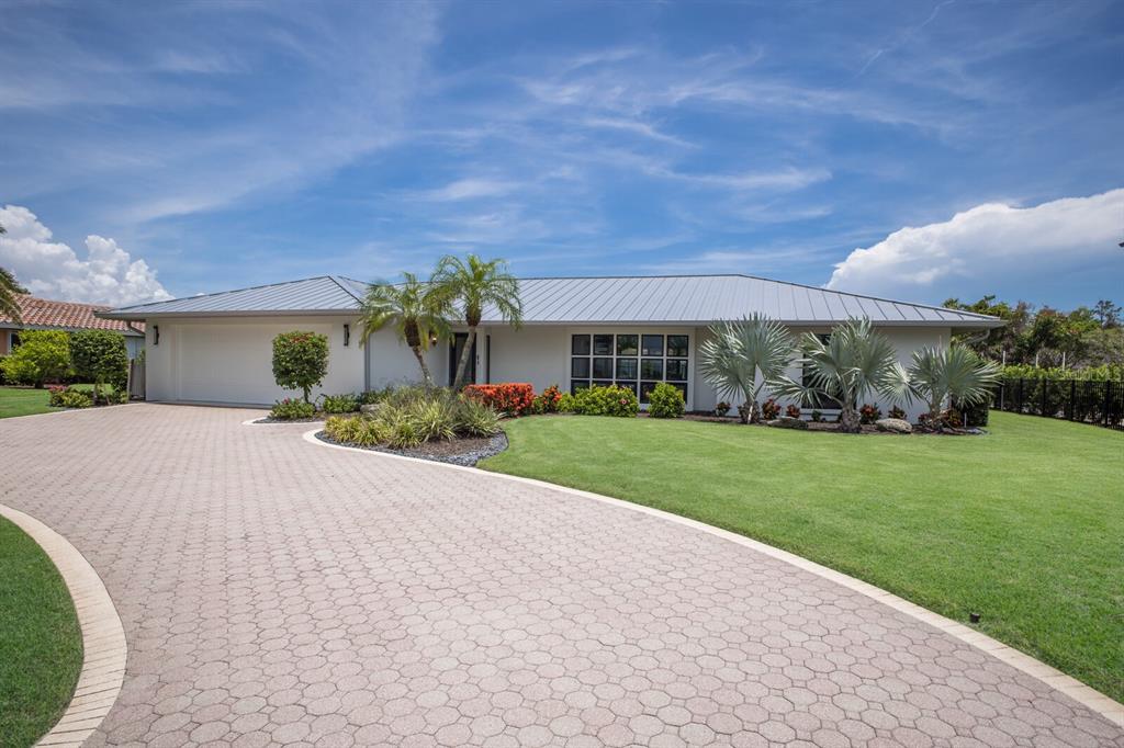 510 Putter Lane Longboat Key, FL 34228 - Photo 30 of 74 front view of a house with a yard