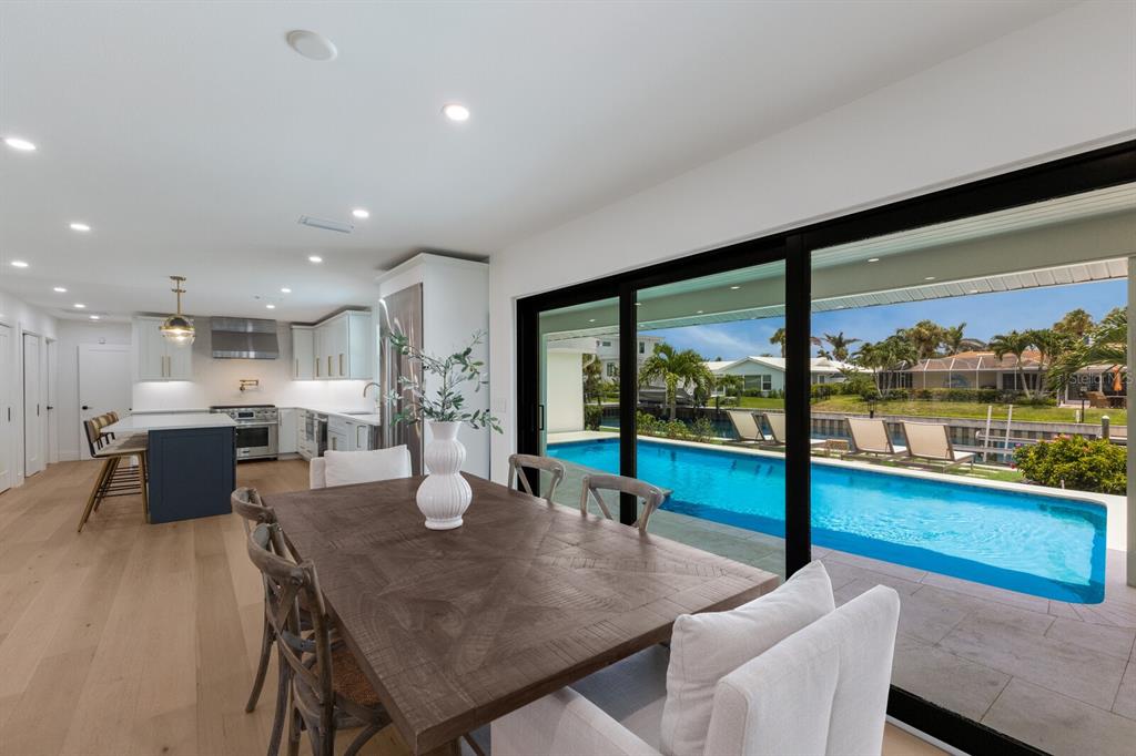510 Putter Lane Longboat Key, FL 34228 - Photo 40 of 74 a view of a dining room with furniture window and outside view