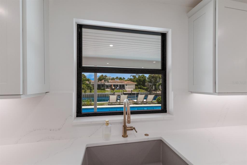 510 Putter Lane Longboat Key, FL 34228 - Photo 47 of 74 a bathroom with a sink and a window