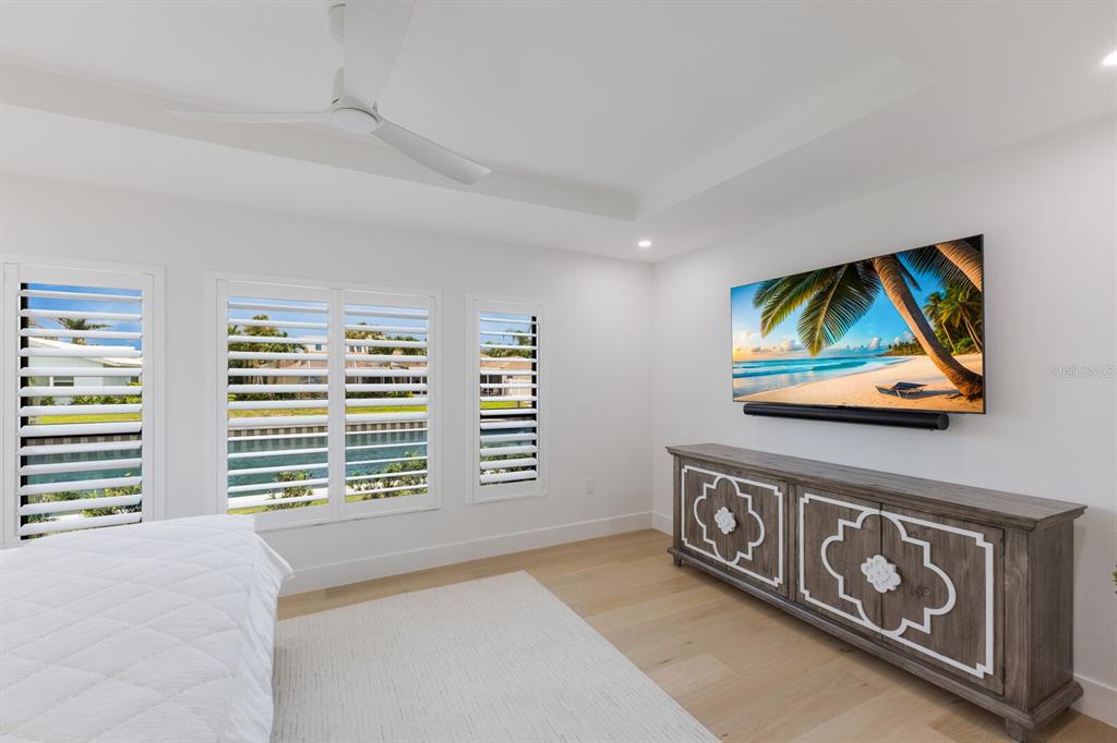 510 Putter Lane Longboat Key, FL 34228 - Photo 56 of 74 a view of a room with furniture and a flat screen tv