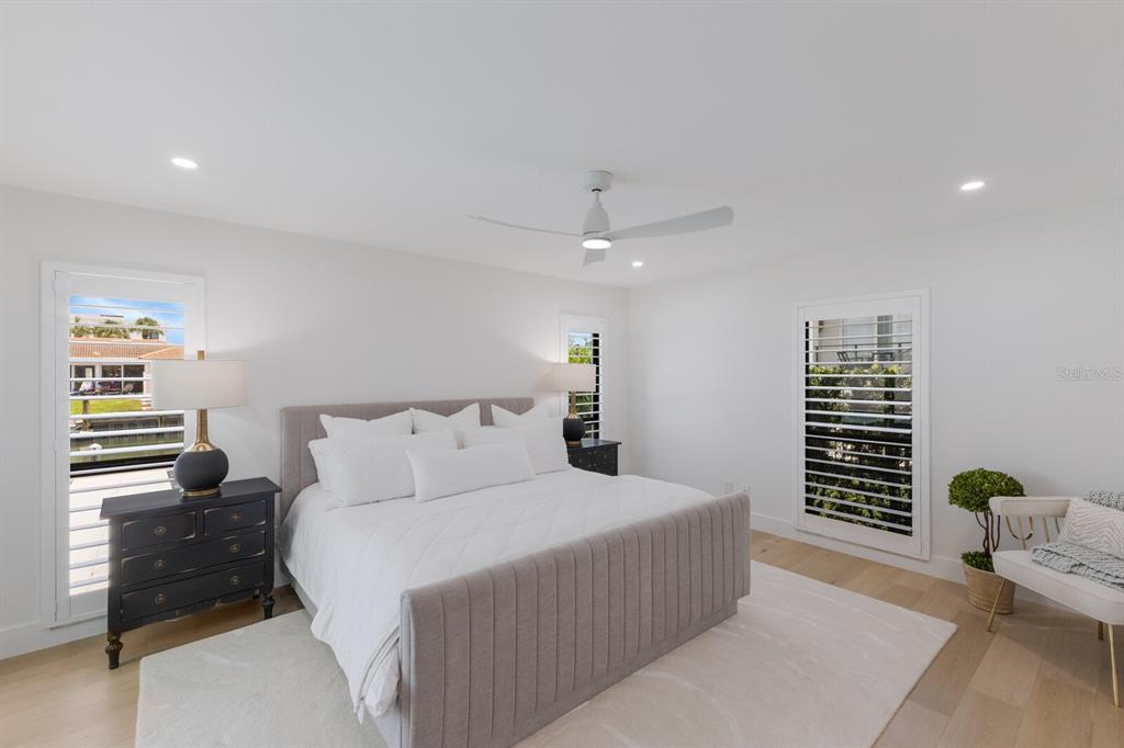 510 Putter Lane Longboat Key, FL 34228 - Photo 57 of 74 a bedroom with a bed and a window