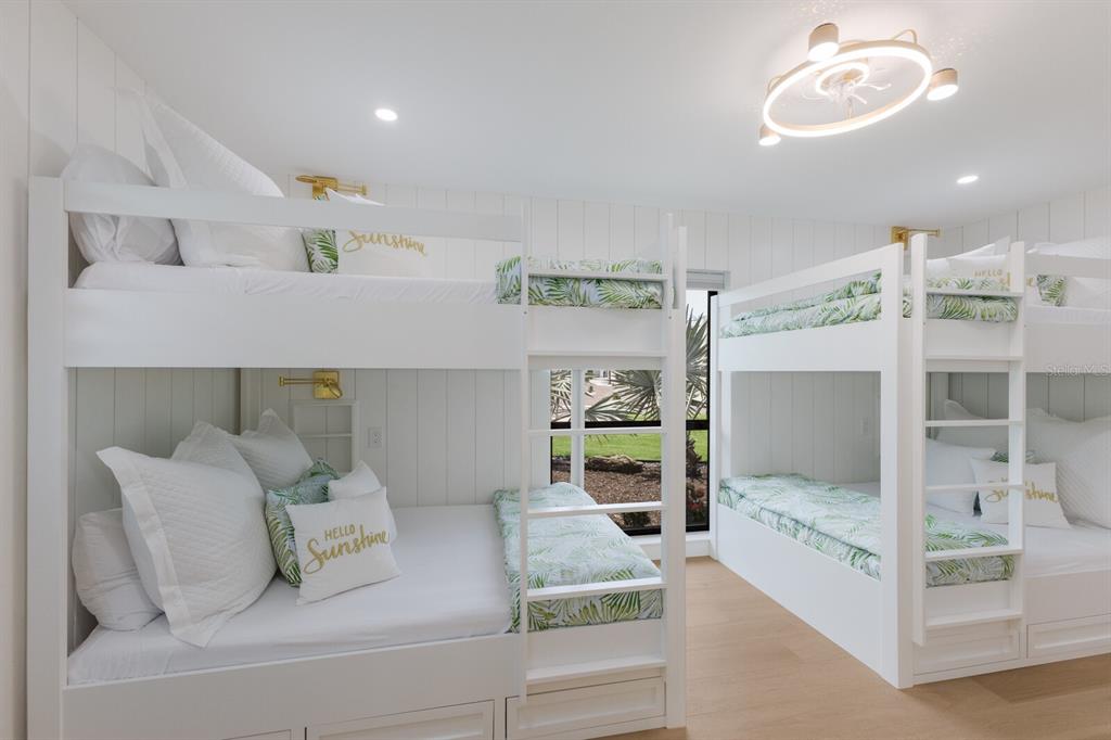 510 Putter Lane Longboat Key, FL 34228 - Photo 62 of 74 a living room with furniture and a chandelier