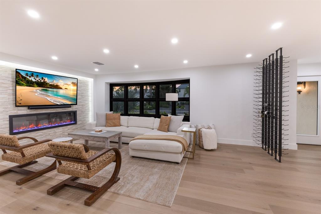 510 Putter Lane Longboat Key, FL 34228 - Photo 7 of 74 a living room with furniture and a flat screen tv