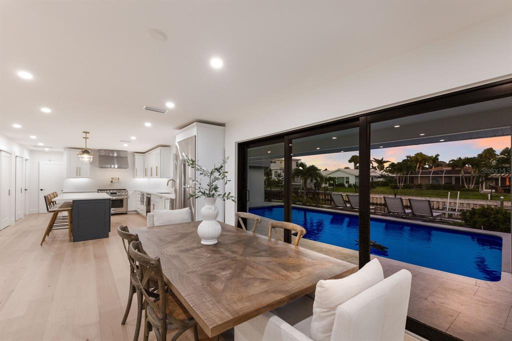 510 Putter Lane Longboat Key, FL 34228 - Photo 9 of 74 a view of a dining room with furniture window and outside view