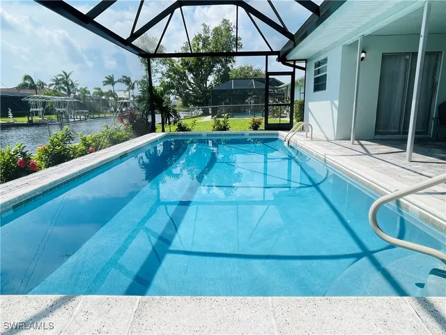 a view of swimming pool with a patio