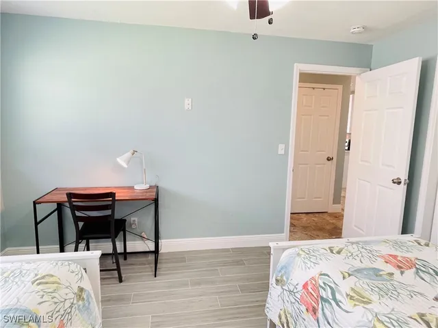 a workspace with furniture window and wooden floor
