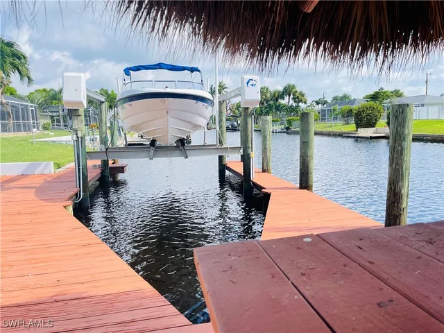 a view of a lake with a bench next to a lake