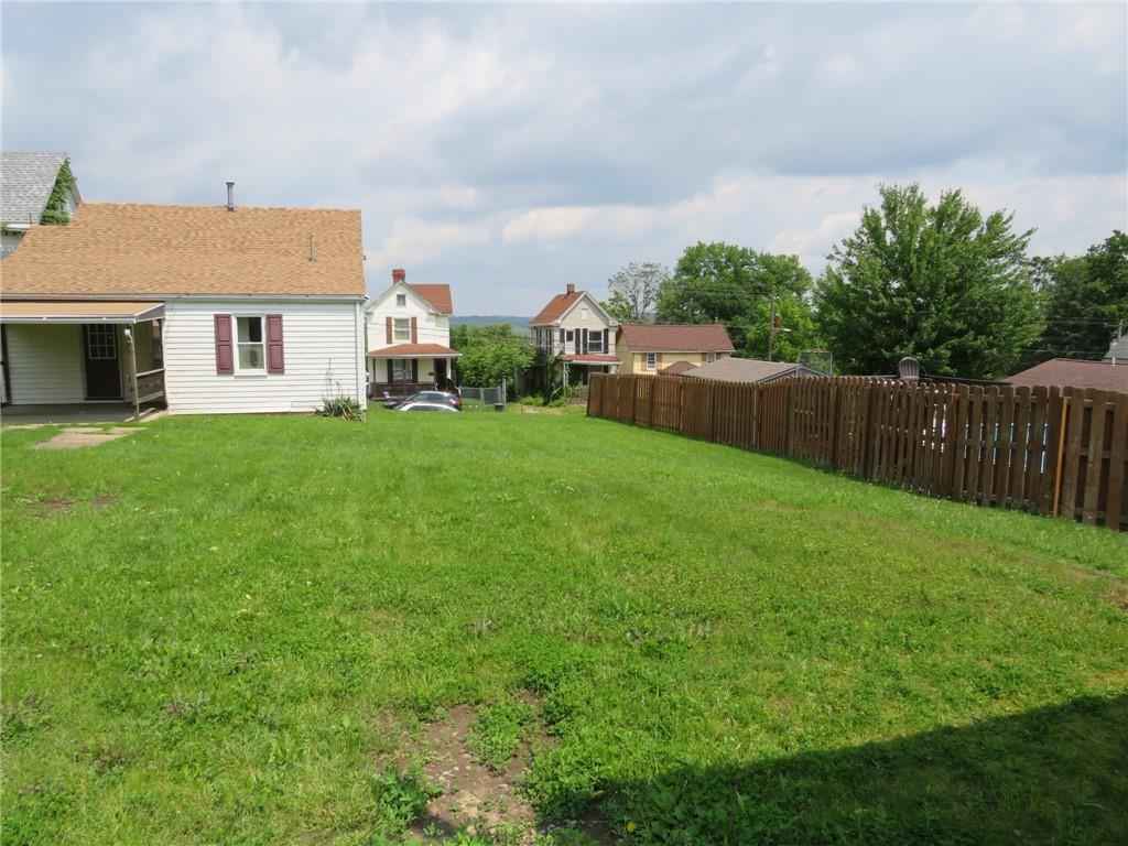 666 Ewing Street Washington, PA 15301 - Photo 17 of 22 a view of a house with backyard and porch
