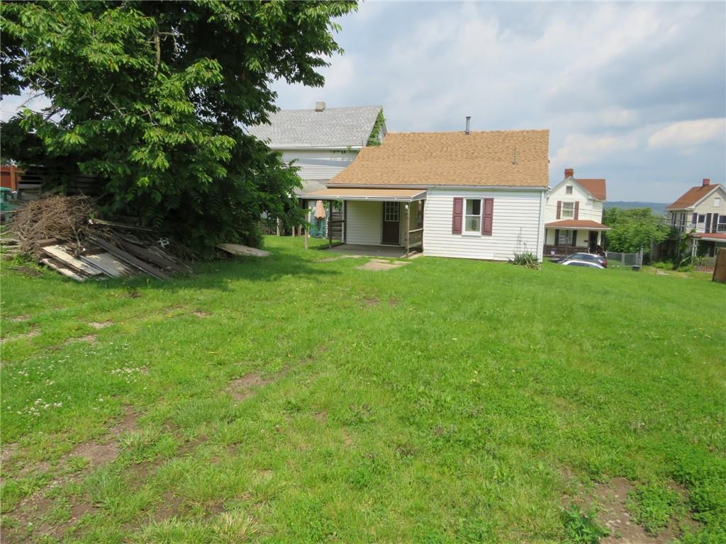 666 Ewing Street Washington, PA 15301 - Photo 18 of 22 a front view of a house with yard and green space