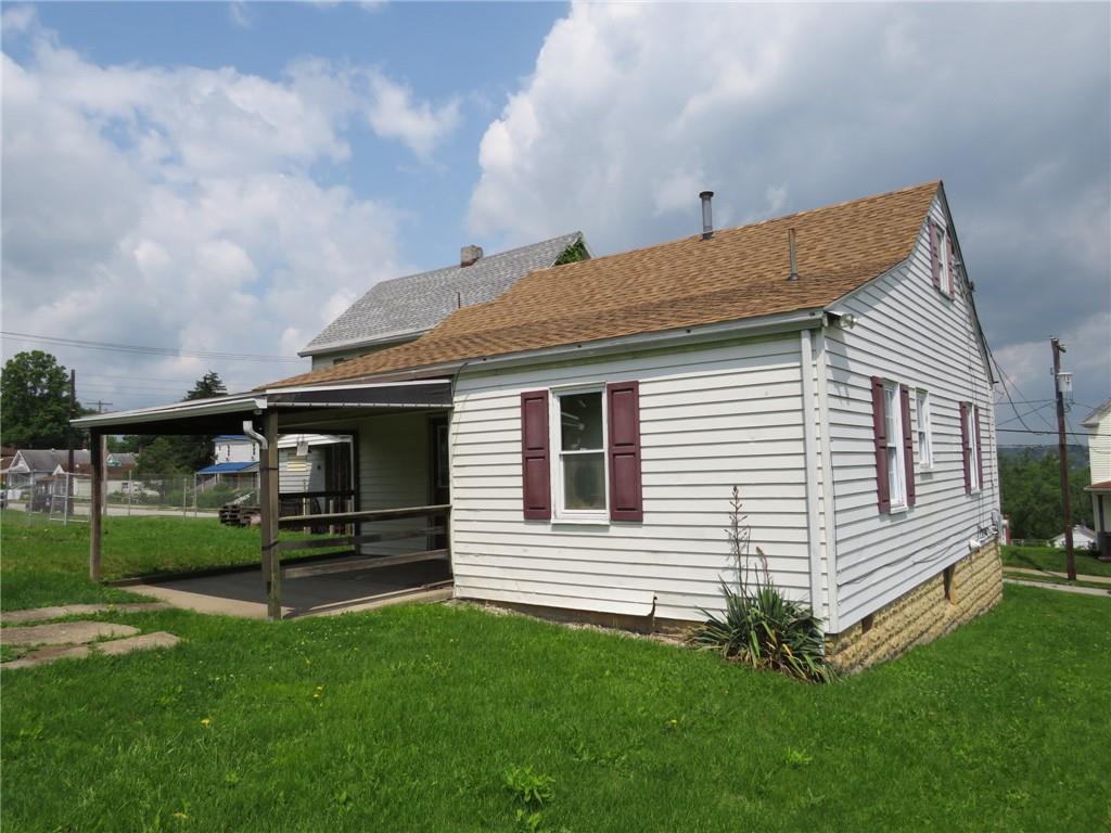 666 Ewing Street Washington, PA 15301 - Photo 21 of 22 a front view of a house with a garden