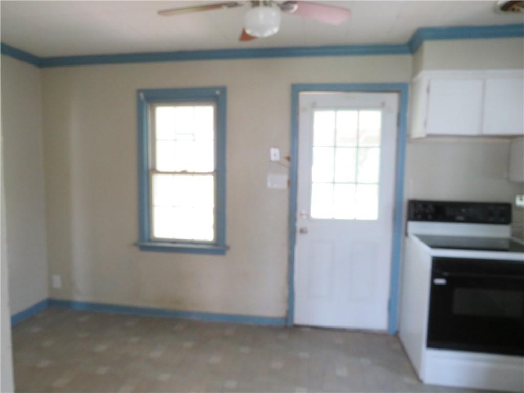 666 Ewing Street Washington, PA 15301 - Photo 3 of 22 an empty room with windows and fireplace