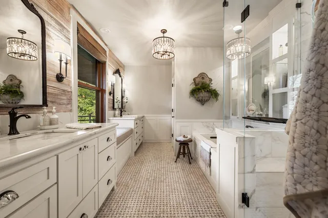 a bathroom with a double vanity sink mirror and