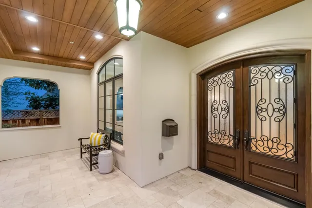 a view of a room with furniture and windows