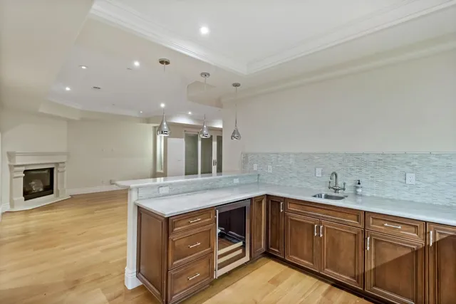 a view of wooden staircase with a rug