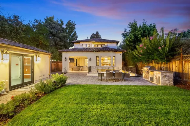 a front view of house with yard outdoor seating and barbeque oven