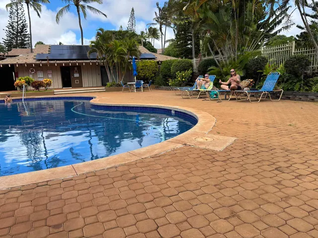 a view of a swimming pool with a patio