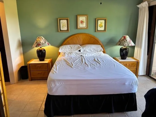 a bedroom with a bed and dresser