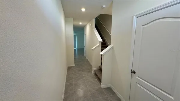 a view of a hallway with windows