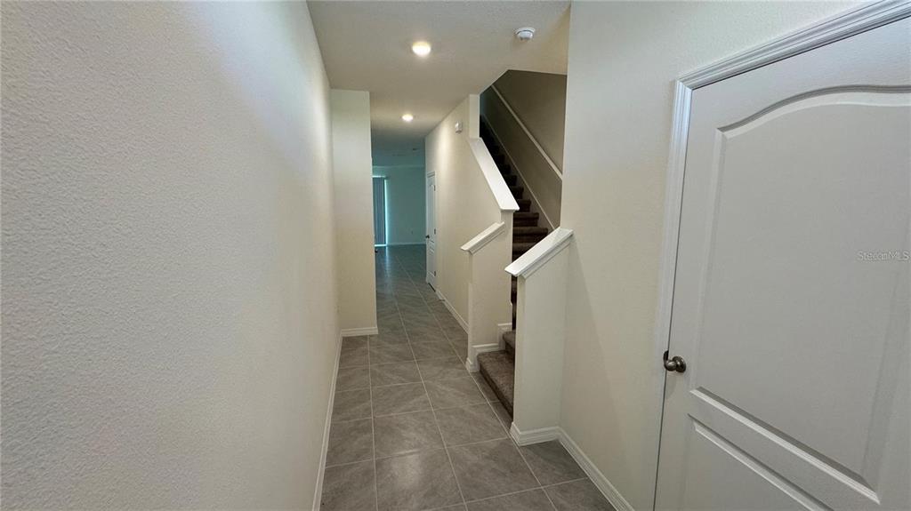 1442 Isleta Loop Kissimmee, FL 34741 - Photo 11 of 28 a view of a hallway with windows