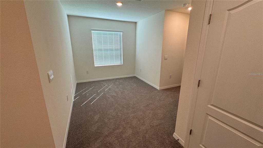1442 Isleta Loop Kissimmee, FL 34741 - Photo 17 of 28 an empty room with windows