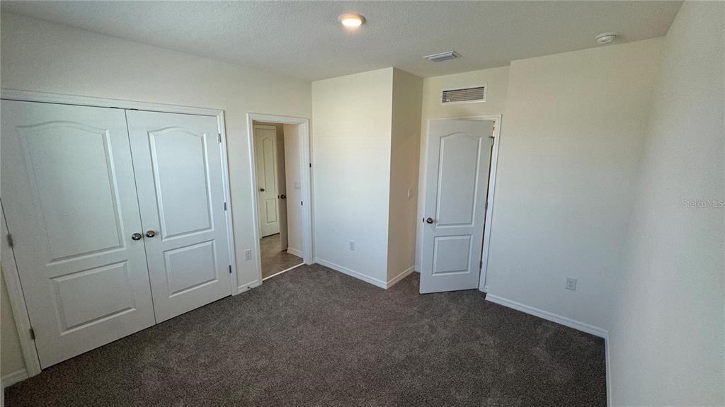 1442 Isleta Loop Kissimmee, FL 34741 - Photo 23 of 28 a view of an empty room