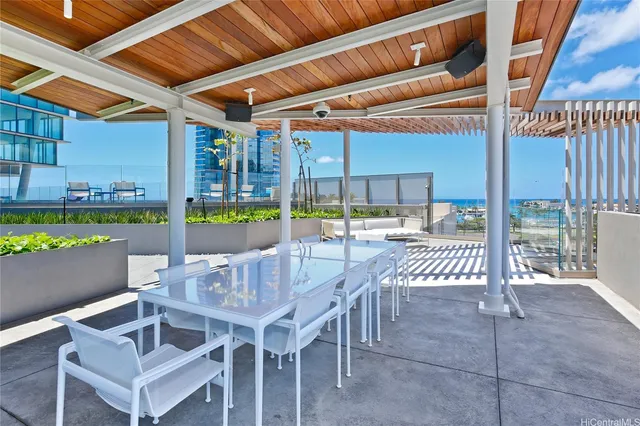 a view of a patio with a table and chairs