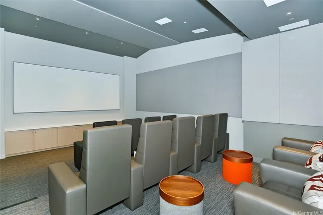 a blue room with a couch and a potted plant