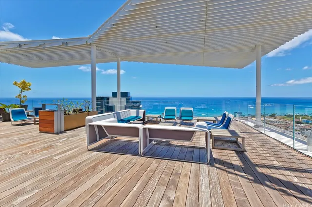 a view of a patio with dining table and chairs with wooden floor