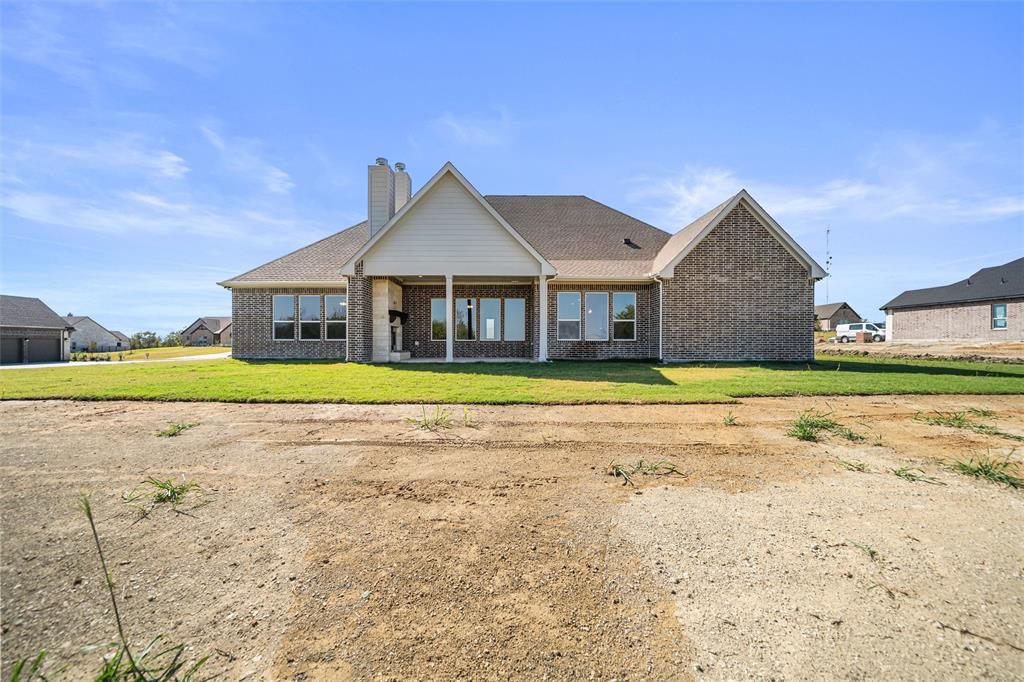 404 Indian Creek Road Van Alstyne, TX 75495 - Photo 32 of 40 a view of house with a garden and yard