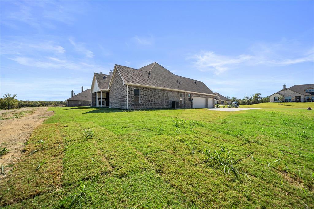 404 Indian Creek Road Van Alstyne, TX 75495 - Photo 35 of 40 a house view with a garden space