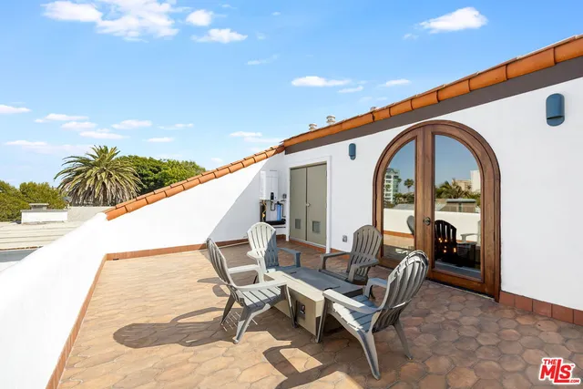 a view of swimming pool with outdoor seating and stairs