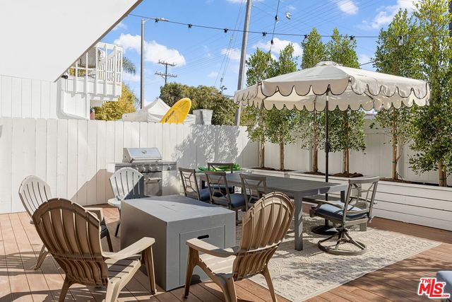 a view of outdoor dining space with a patio and plants