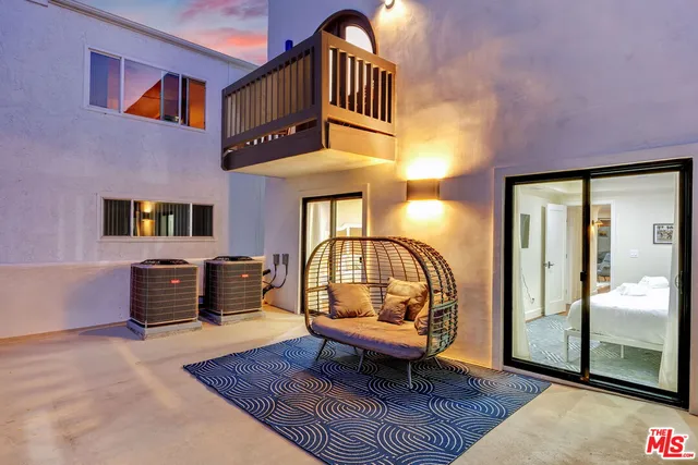 a view of a brick building with many windows