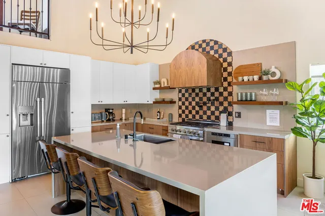 a kitchen with a table chairs and a stove