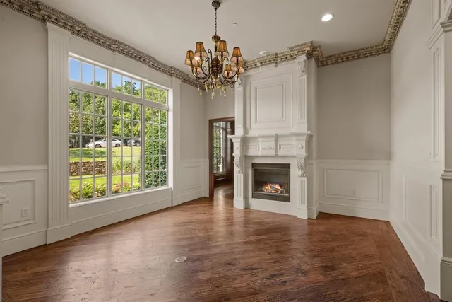 a view of a room with window fireplace and chandelier