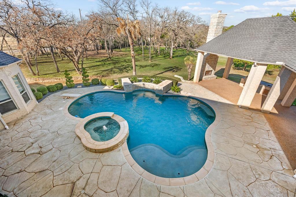 1600 Enclave Court Southlake, TX 76092 - Photo 32 of 40 a view of a swimming pool with lounge chair